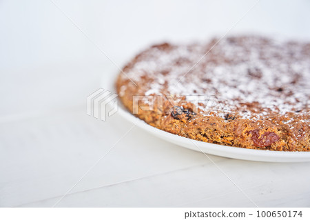 Part of a carrot and raisin pie. The pie is gluten-free, milk-free and egg-free. Selective focus, space for text. Diet dessert. The concept of healthy eating. High quality photo Part of a carrot and raisin pie. The pie is gluten-free, milk-free and egg-free. Selective focus, space for text. Diet dessert. The concept of healthy eating. High quality photo 100650174