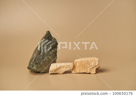 Podium, stand, stage or platform of three stones for the presentation of your products with space for copying. High quality photo Podium, stand, stage or platform of three stones for the presentation of your products with space for copying. High quality photo 100650176