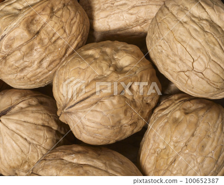 Whole walnuts as background 100652387