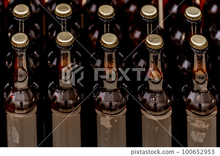 glass bottles with beer on the store shelf glass bottles with beer on the store shelf 100652953