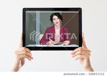 Online webinar. Video chat. E-learning course. Digital education. Female hands showing online business coach on tablet screen isolated on white. 100653152