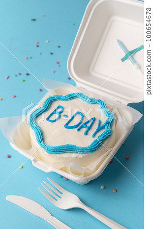 Small bento cake In box on blue background 100654678