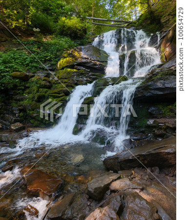 waterfall in the beech forest. nature background on sunny summer morning waterfall in the beech forest. nature background on sunny summer morning 100654729