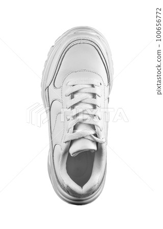 White sneaker top view on a white background. Sport shoes. White sneaker top view on a white background. Sport shoes. 100656772