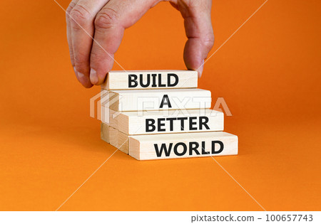 Build a better world symbol. Concept words Build a better world on wooden cubes. Beautiful orange table orange background. Businessman hand. Business build a better world concept. Copy space. Build a better world symbol. Concept words Build a better world on wooden cubes. Beautiful orange table orange background. Businessman hand. Business build a better world concept. Copy space. 100657743
