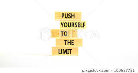 Push the limit symbol. Concept words Push yourself to the limit on wooden blocks. Beautiful white table white background. Business push the limit concept. Copy space. Push the limit symbol. Concept words Push yourself to the limit on wooden blocks. Beautiful white table white background. Business push the limit concept. Copy space. 100657781