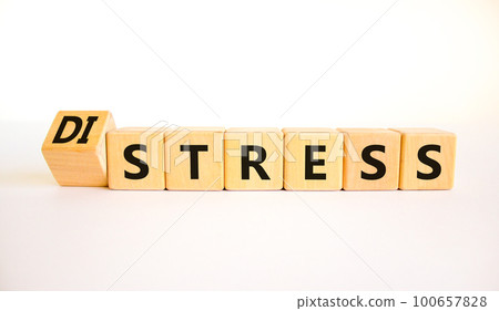 Distress or stress symbol. Turned the wooden cube and changed the concept word Distress to Stress. Beautiful white table white background, copy space. Psychlogical and stress or distress concept. Distress or stress symbol. Turned the wooden cube and changed the concept word Distress to Stress. Beautiful white table white background, copy space. Psychlogical and stress or distress concept. 100657828