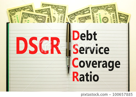 DSCR debt service coverage ratio symbol. Concept words DSCR debt service coverage ratio on white note on beautiful white background. Business DSCR debt service coverage ratio concept. Copy space. DSCR debt service coverage ratio symbol. Concept words DSCR debt service coverage ratio on white note on beautiful white background. Business DSCR debt service coverage ratio concept. Copy space. 100657885