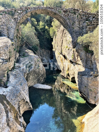 Old stone bridge over a river in Turkey Old stone bridge over a river in Turkey 100658304
