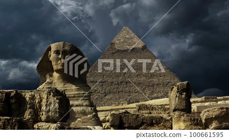 Pyramid and sphinx and storm clouds 100661595