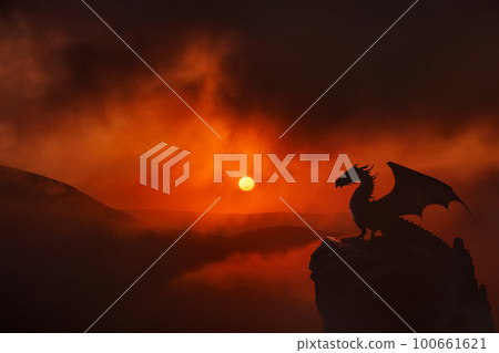 Dragon dramatic sunset in clouds 100661621