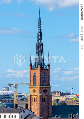 Pointed church tower on the island of Riddarholmen. Part of the former medieval abbey in Stockholm, Sweden. Burial site of most Swedish kings from the 17th century until 1950 Pointed church tower on the island of Riddarholmen. Part of the former medieval abbey in Stockholm, Sweden. Burial site of most Swedish kings from the 17th century until 1950 100662921