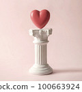 An antique Roman column with the symbol of the romantic heart.  100663924