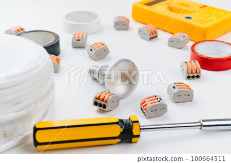 working tools for an electrician on a white background. 100664511