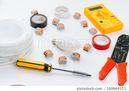 working tools for an electrician on a white background. 100664521