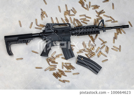 M4 carbine and 5.56mm shells and magazine with bullets 100664623