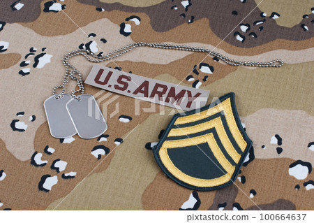 US ARMY staff sergeant rank patch and dog tags on Desert Battle Dress Uniform 100664637