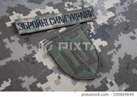 KYIV, UKRAINE - October 6, 2022. Russian invasion in Ukraine 2022. Territorial Defence Forces of Ukraine uniform insignia badge. KYIV, UKRAINE - October 6, 2022. Russian invasion in Ukraine 2022. Territorial Defence Forces of Ukraine uniform insignia badge. 100664640