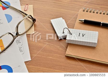 A desk with a deck of cards marked IV 100665533