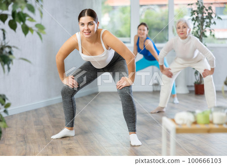 Young woman doing fitness in fitness studio Young woman doing fitness in fitness studio 100666103