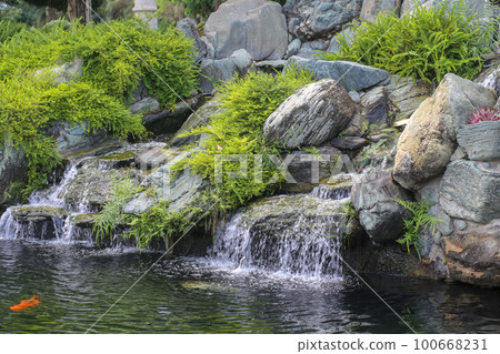 Tranquil waterfall stream at Vinhomes Central Park, Ho Chi Minh city 100668231