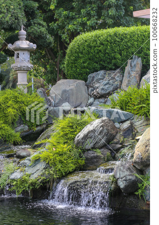 Tranquil waterfall stream at Vinhomes Central Park, Ho Chi Minh city 100668232