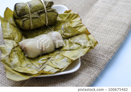 Khao Tom Mad or Dessert sticky rice,banana or taro filling inside. Ancient Thai desserts. Copy space 100675482