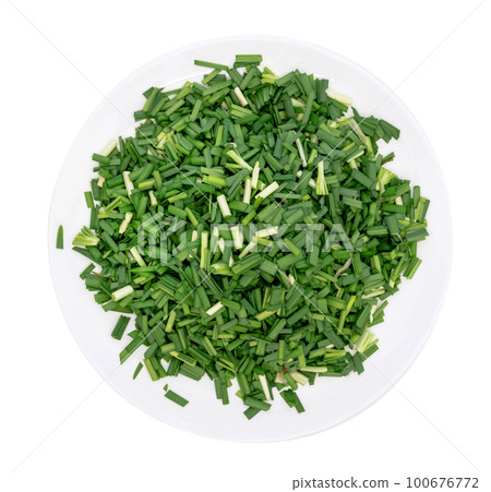 Chop up the garlic chive on white dish,top view isolated Chop up the garlic chive on white dish,top view isolated 100676772