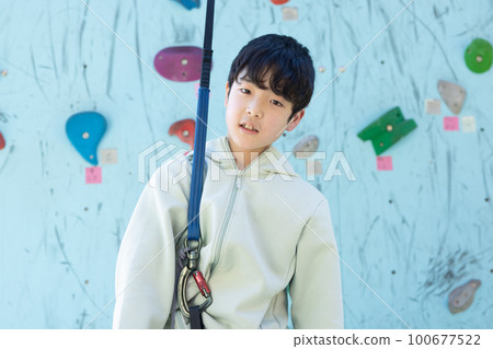 Child enjoying top rope climbing Child enjoying top rope climbing 100677522