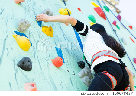 child enjoying climbing 100678457