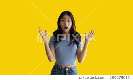 Asian woman acting shocked or surprised isolated on a white background, Looking camera, Concept acts according to the emotions and feelings of excitement and shock, Yellow background, Copy space. Asian woman acting shocked or surprised isolated on a white background, Looking camera, Concept acts according to the emotions and feelings of excitement and shock, Yellow background, Copy space. 100679615
