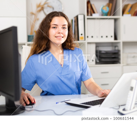 Woman therapist working with case histories at her workplace Woman therapist working with case histories at her workplace 100681544