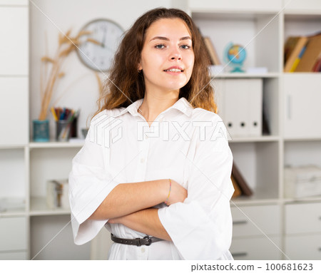 Successful happy young business woman in office 100681623