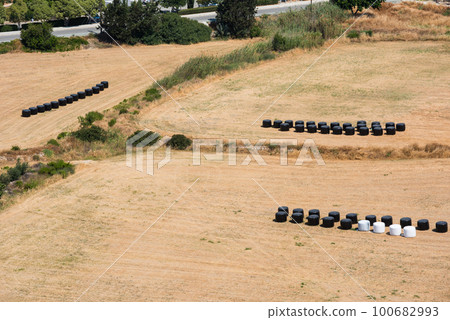 Strawbales in plastic wrap 100682993