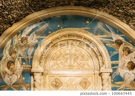 Mosaic panels depicting flying seraphim in chapel-tomb of Paskevich 1870-1889 Years in city park. Famous local landmark Gomel, Belarus. Rumyantsevs and Paskeviches park. Close up Mosaic panels depicting flying seraphim in chapel-tomb of Paskevich 1870-1889 Years in city park. Famous local landmark Gomel, Belarus. Rumyantsevs and Paskeviches park. Close up 100683445