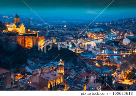 Tbilisi, Georgia. starry sky night sky above cityscape skyline, Scenic View Old Historic District Of Kala. Urban Night Cityscape. Evening Scenic. blue hour. altered sky. Elevated Top View Of Famous 100683618
