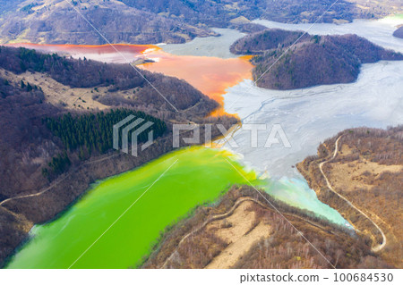 Aerial view of a lake filled with chemical waste water 100684530