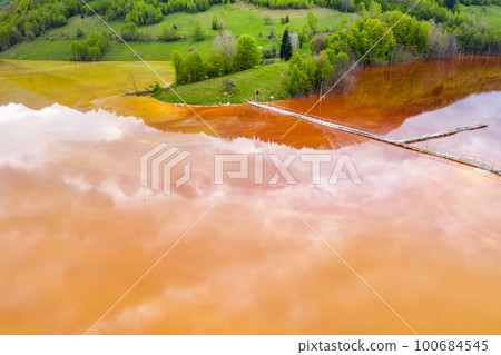 Aerial view of acid colorful mine waste waters Aerial view of acid colorful mine waste waters 100684545