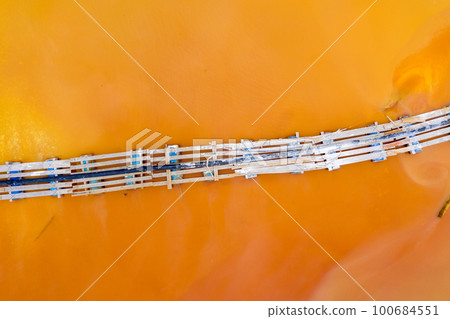 Aerial image of red polluted mining water residuals 100684551