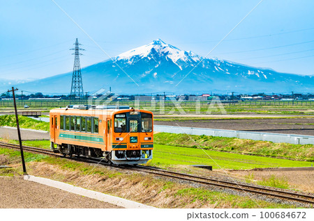 Tsugaru Railway A train that runs through the Tsugaru Plains with Mt. Tsugaru Railway A train that runs through the Tsugaru Plains with Mt. 100684672