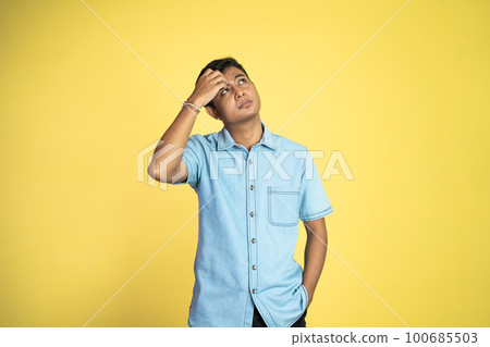 asian man stand with expression of think idea in isolated 100685503