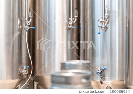 stainless steel tanks for brewing beer in a brewery 100686954