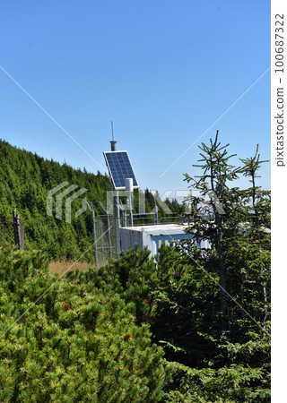 Photovoltaic panel installation in remote mountain range used to power the meteorological station 100687322