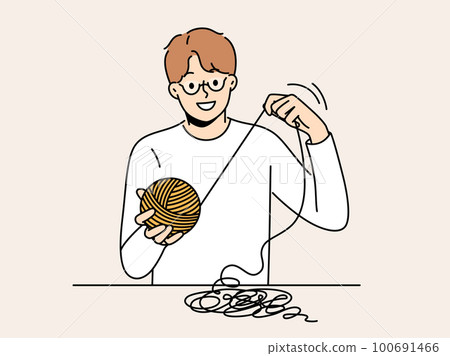 Smiling man with yarn in hands Smiling man with yarn in hands 100691466