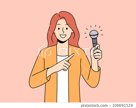 Smiling woman point at microphone in hands  100691529