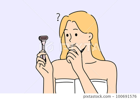 Confused woman with razor in hands think of shaving Confused woman with razor in hands think of shaving 100691576