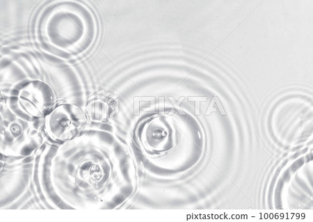 Abstract water, cosmetic background with rings, water surface. Spa concept background. Splash cosmetic moisturizer water micellar toner or emulsion 100691799