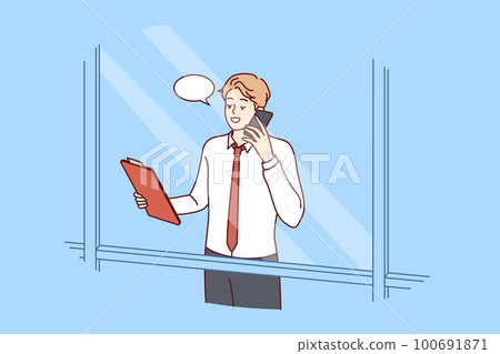 Man head of corporation is talking on phone negotiating, view from behind window skyscraper 100691871