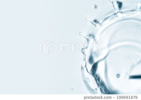 Close-up of fresh and transparent splashes of water or lotion, micellar in the form of a crown Close-up of fresh and transparent splashes of water or lotion, micellar in the form of a crown 100691876