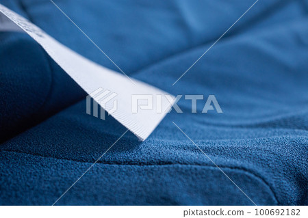 laundry care clothing label on blue dress laundry care clothing label on blue dress 100692182